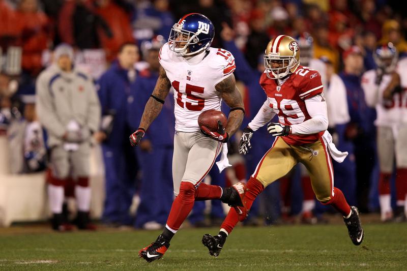 Devin Thomas #15 of the New York Giants advances the ball after he recovered on a punt touched by Chris Culliver #29 of the San Francisco 49ers.